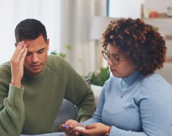 Woman supporting a man